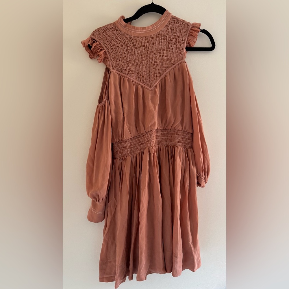 Cinc à sept.   long sleeves and a playful tiered skirtMock turtleneck